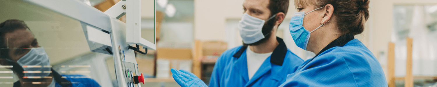 Supporting your workforce - production factory workers wearing masks follwoing COVID-19